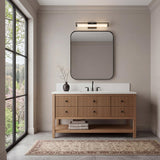 Ian LED Vanity Light, Matte Black linear Vanity in a Transitional Bathroom with a fluted wood vanity and patterned rug.