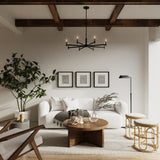 Carson 8 Light 36" Modern Chandelier, Matte Black, shown in a white living room with wooden ceiling beams, a white sofa, and organic modern decor