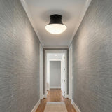 Jayden Flush Mount 14", Matte Black geometric flush mount in a Transitional Hallway with grey grasscloth wallpaper and white trim.