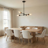 Matte Black geometric chandelier in a Modern Dining Room with a light wood dining table.