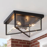 A traditional home porch featuring the Miles Indoor/Outdoor Flush Mount 12 inch in matte black glowing on a white ceiling above red brick walls and molding.