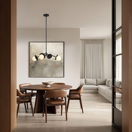 Levi pendant in black, shown in a modern dining room witha  wooden table and chairs, light gray sofa, and abstract art on the wall.