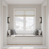 Two Bristol indoor, outdoor 15" wall sconces, shown in a reading nook, on either side of a built-in window bench