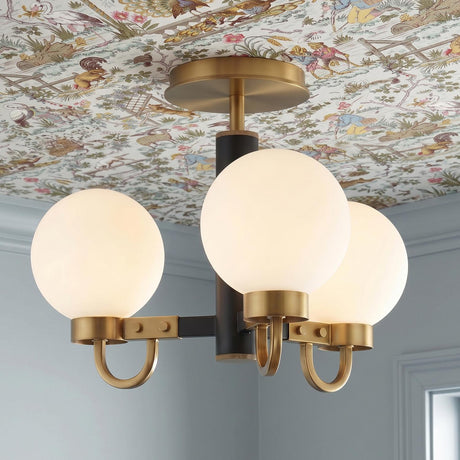 A transitional foyer with the Ryan 3 Light Semi-Flush in matte black and aged brass installed on a patterned toile wallpapered ceiling above light blue walls.
