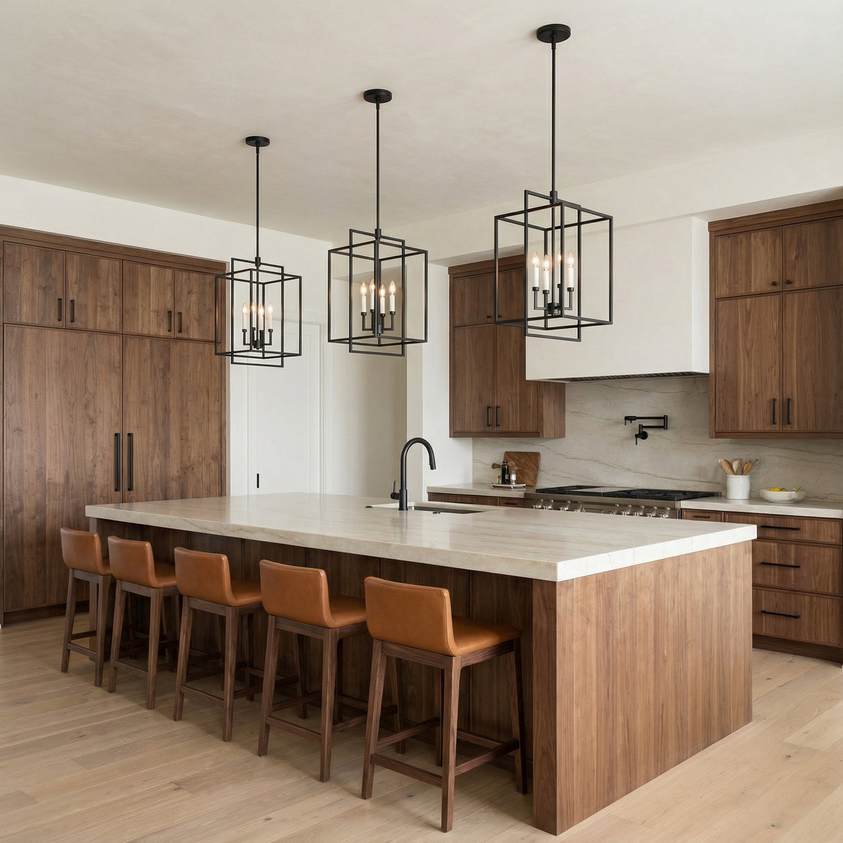Matte Black with White geometric pendant in a Transitional Kitchen with a marble island and leather bar stools.
