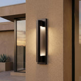 Austin LED Outdoor Wall Light, Black linear Outdoor Wall in a Modern Outdoor with stucco walls and an agave plant.