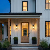 Paterson Outdoor Wall Light, Medium Matte Black geometric Outdoor Wall in a Modern Farmhouse Outdoor with a natural wood door.