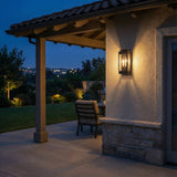 Brighton Outdoor Wall Light, Black geometric Outdoor Wall in a Mediterranean Outdoor space with stucco walls and stone accents.
