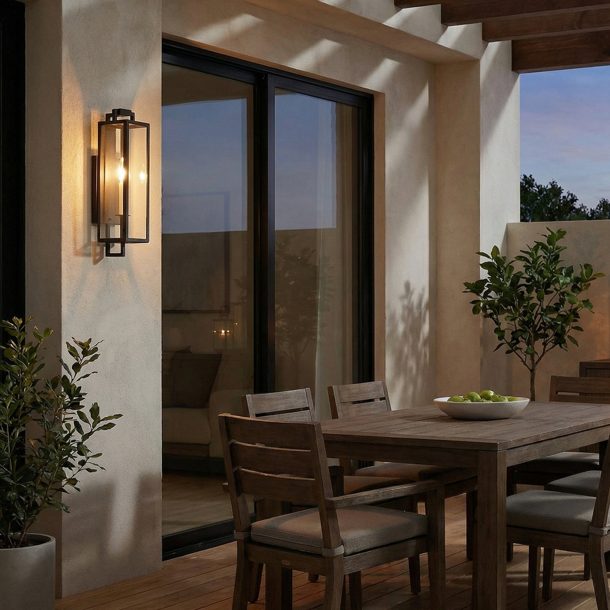 Everett Outdoor Wall Light, Small, Forged Iron Black geometric Outdoor Wall in a Mediterranean Outdoor with a rustic wooden dining table.