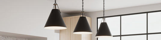 Black Bowie Pendants hung in a bright modern kitchen