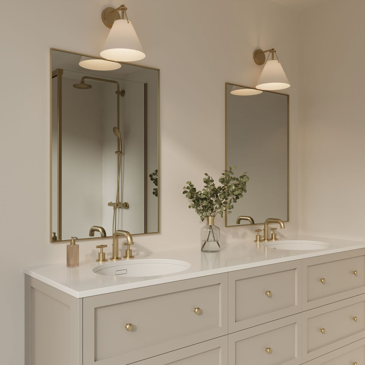 Bowie Wall Sconce in white with brass finish shown above two vanity mirrors.