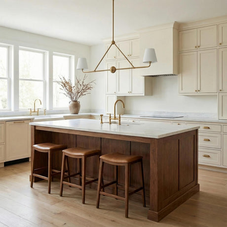 Banks 2 Shade Linear Pendant 42", White and Brass linear pendant in a Transitional Kitchen with a white marble island and leather bar stools.