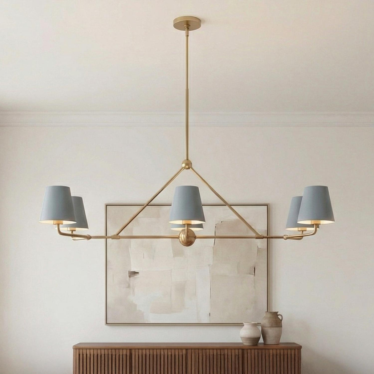 Banks 6 Light Linear Chandelier 46", French Blue and Brass geometric Chandelier in a Contemporary Living Room with a wooden slatted sideboard.