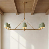 Banks 6 Light Linear Chandelier 46", Sage Green and Brass linear Chandelier in a Modern Farmhouse Dining Room with a wood beam ceiling.
