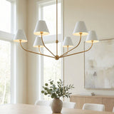 Banks 6 Light Chandelier 48", White and Brass Brass linear Chandelier in a Transitional Dining Room with a light wood table and abstract art.