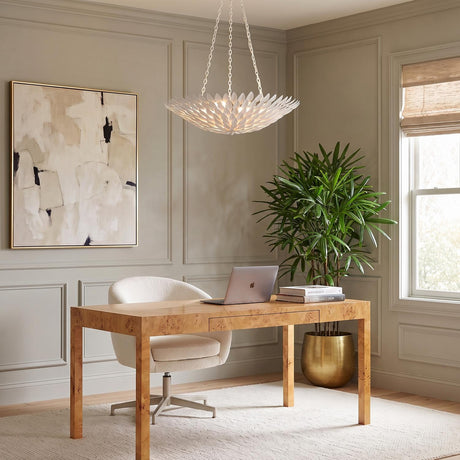 A transitional office with the matte white Alysa Pendant 24" hanging over a burl wood desk, featuring taupe wainscoting, an abstract painting, and a textured white chair.