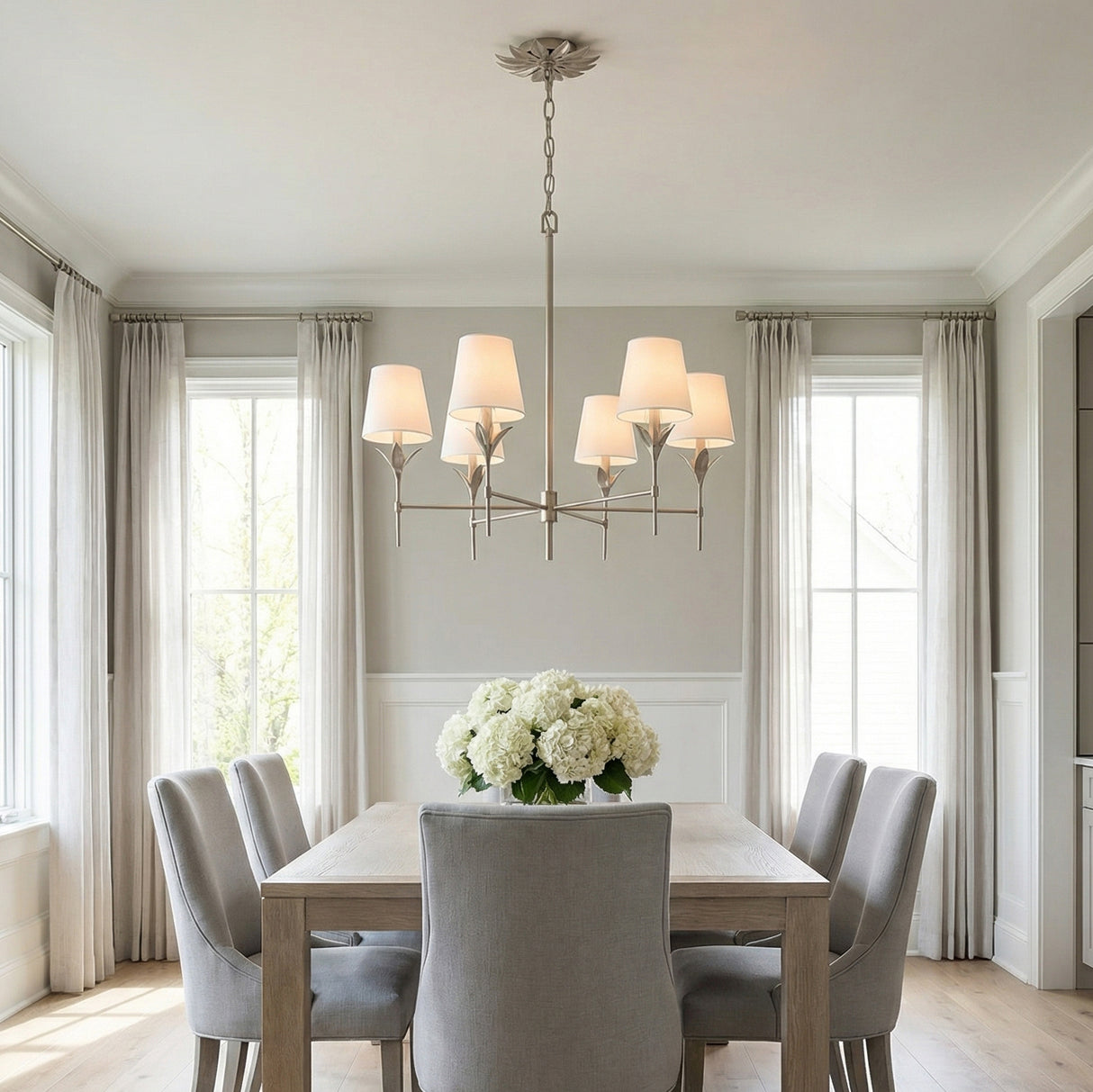 Alice 6 Light Chandelier 32", Antique Silver leaf design Chandelier in a Transitional Dining Room with a light wood dining table.