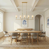 Alice 5 Light Linear Chandelier 53", Antique Gold leaf design Linear Chandelier in a Transitional Dining Room with an oval oak table.