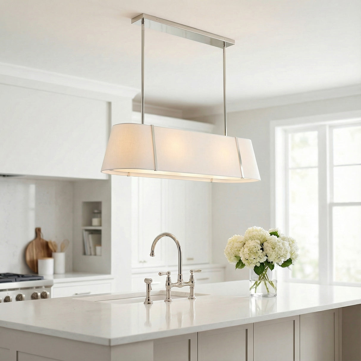 Hoyt Linear Pendant 42", Polished Nickel linear pendant in a Transitional Kitchen with a white marble island.