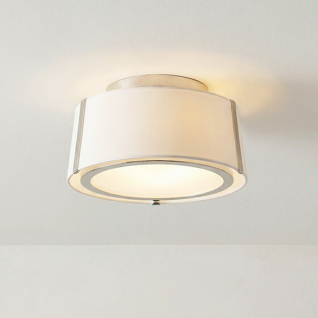Hoyt Flush Mount 12", Polished Nickel linear flush mount in a Transitional Bedroom with a neutral white ceiling.