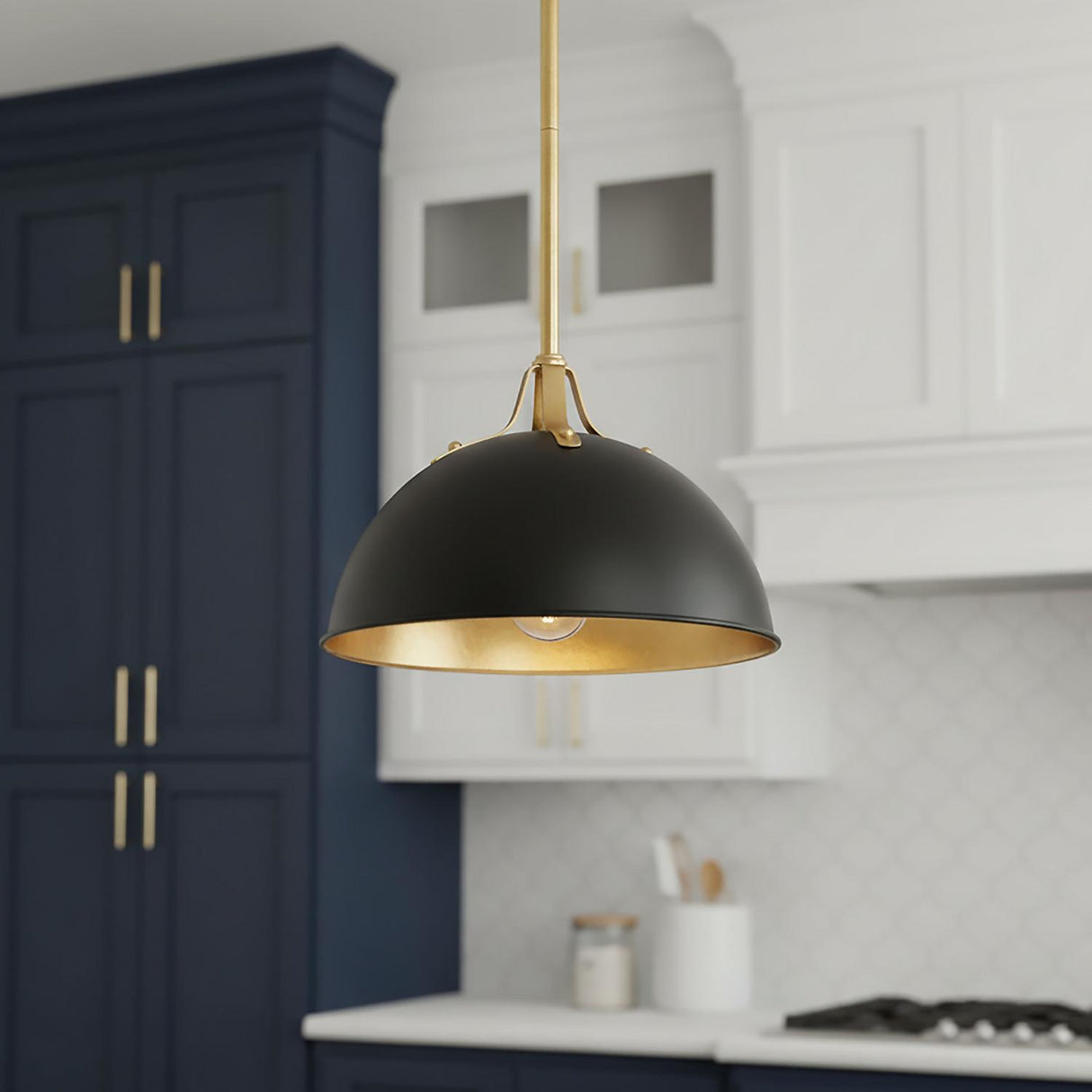 A transitional kitchen featuring a Grant Small Pendant 12", Black and Antique Gold in matte black and antique gold over the island, with navy blue shaker cabinets.
