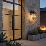 Ellington Outdoor Wall Light, Extra Large 30" Black geometric Outdoor Wall in a Modern Outdoor with a stone wall and concrete planters.