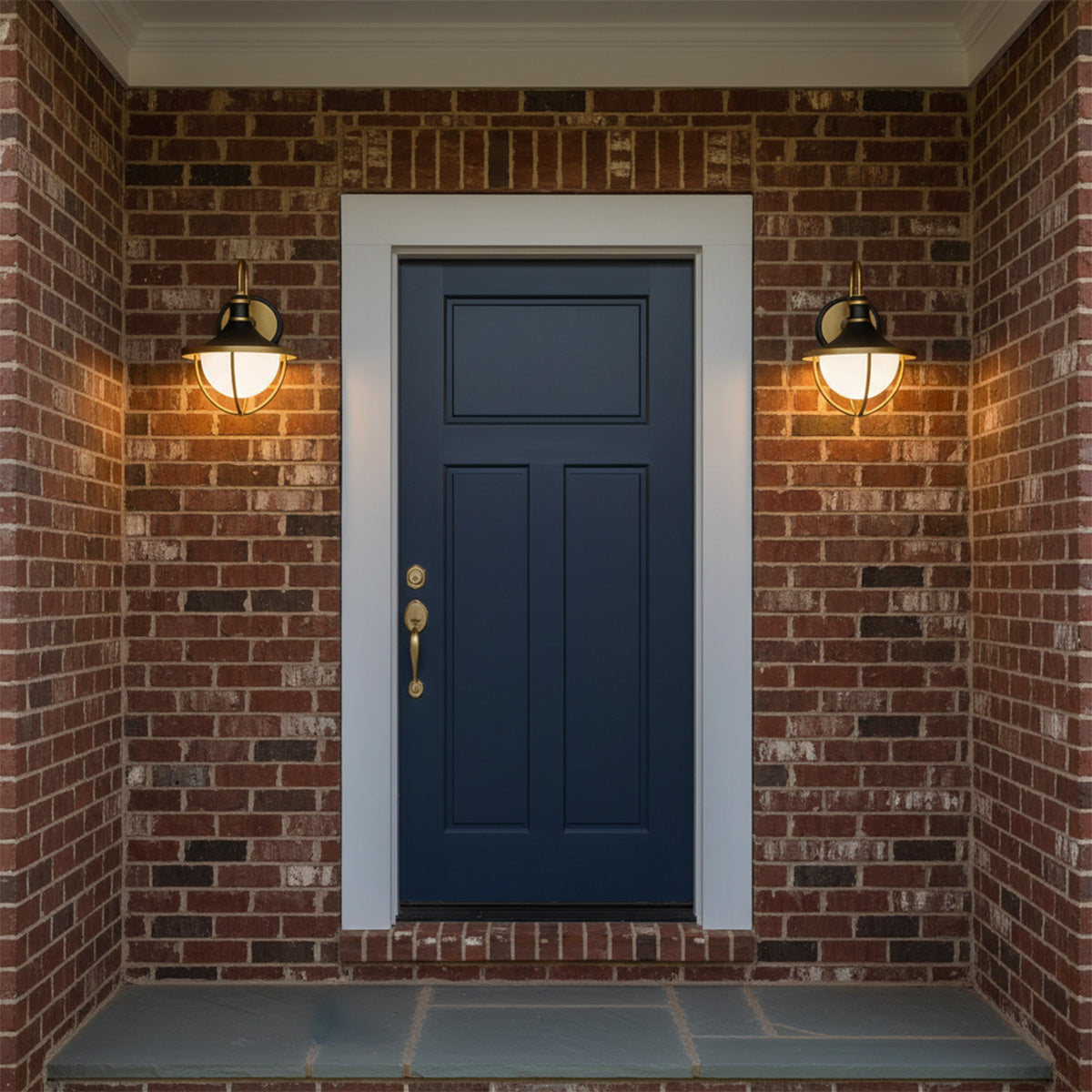 Tobin Outdoor Wall Light, Small 13" Black and Textured Gold - Two black and gold outdoor wall lights flank a blue front door on a brick facade.