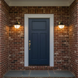 Tobin Outdoor Wall Light, Small 13" Black and Textured Gold - Two black and gold outdoor wall lights flank a blue front door on a brick facade.