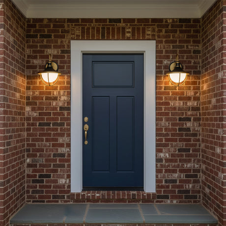 Tobin Outdoor Wall Light, Small 13" Black and Textured Gold - Two black and gold outdoor wall lights flank a blue front door on a brick facade.