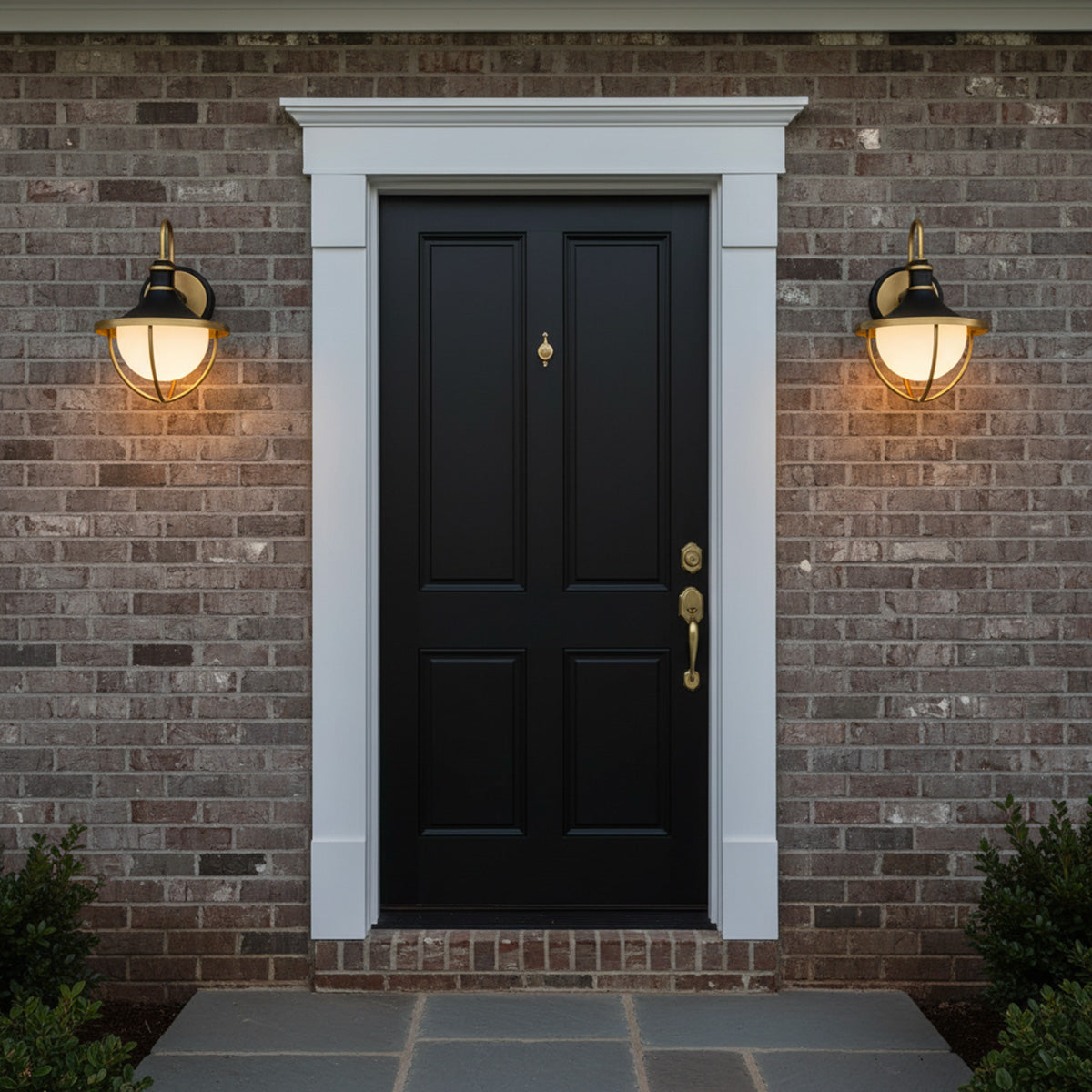 Tobin Outdoor Wall Light, Small 13" Black and Textured Gold - Two outdoor lights flank a black door