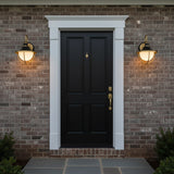 Tobin Outdoor Wall Light, Small 13" Black and Textured Gold - Two outdoor lights flank a black door