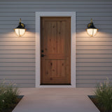 Tobin Outdoor Wall Light, Medium 19" Black and Textured Gold - Two outdoor wall lights flanking a wooden front door