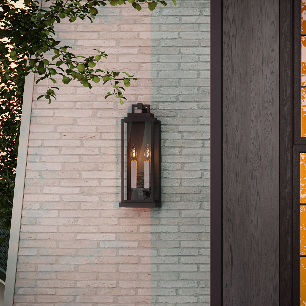 Easton medium 19" tall outdoor wall light in black with two white square candle sleeves and clear glass panels.