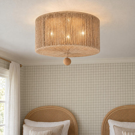 A cottage bedroom featuring the Selma Flush Mount 16", Jute and Satin Sand fixture mounted on the ceiling above arched rattan headboards and plaid wallpaper.