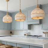 Sienna Medium Pendant 14, Rattan and Soft Brass for Coastal home with Gray Siding