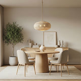 Sienna 4 Light Pendant 22" Rattan and Soft Brass in a Modern Dining Room with wood and neutral furnishings.