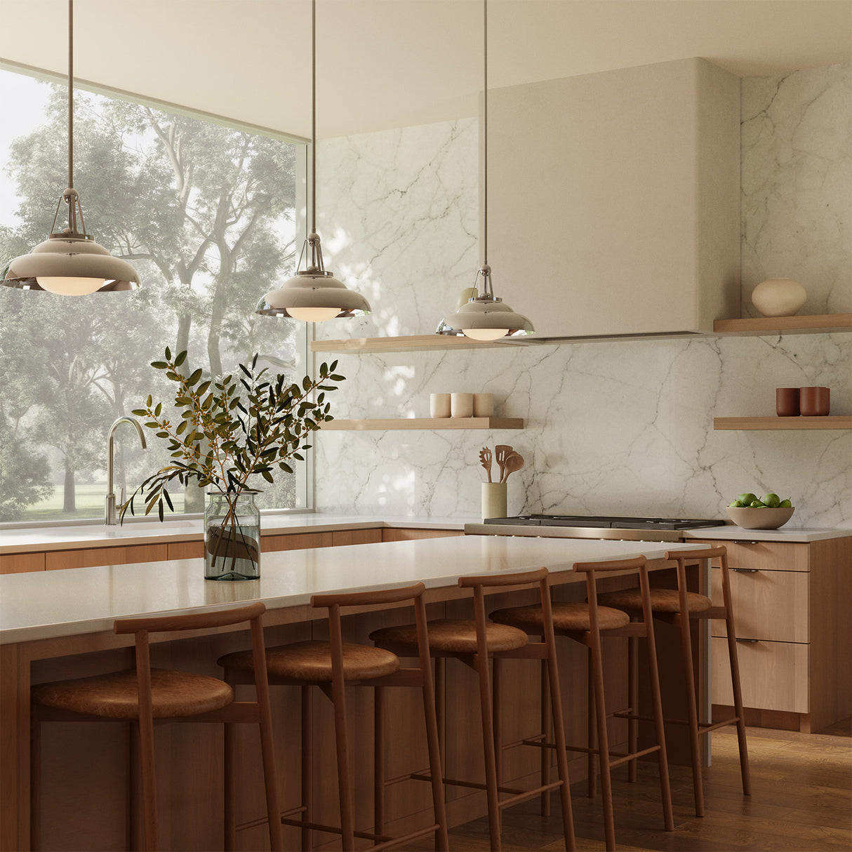A modern kitchen with large picture window with three Neville 14" metal pendant lights in polished nickel hung above the long kitchen island.