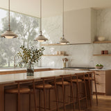 A modern kitchen with large picture window with three Neville 14" metal pendant lights in polished nickel hung above the long kitchen island.