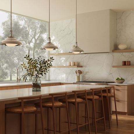 A modern kitchen with large picture window with three Neville 14" metal pendant lights in polished nickel hung above the long kitchen island.