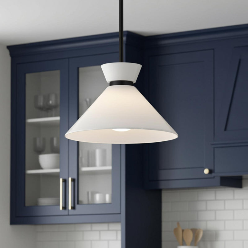 A transitional kitchen featuring the Cori Medium Pendant 14", Matte Black and Milk Glass along the perimeter near navy blue cabinets and white subway tile backsplash.