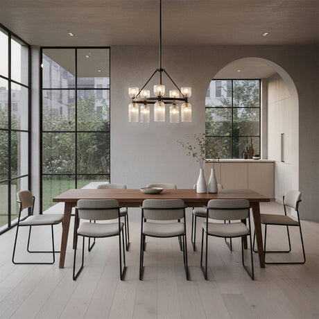 Elle Chandelier 26, Matte Black and Clear Glass - A modern dining room with a wooden table, chairs, and a chandelier hanging above.