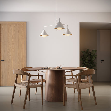Juno 38" wide three light chandelier in white finish above a round modern dining table with four chairs.