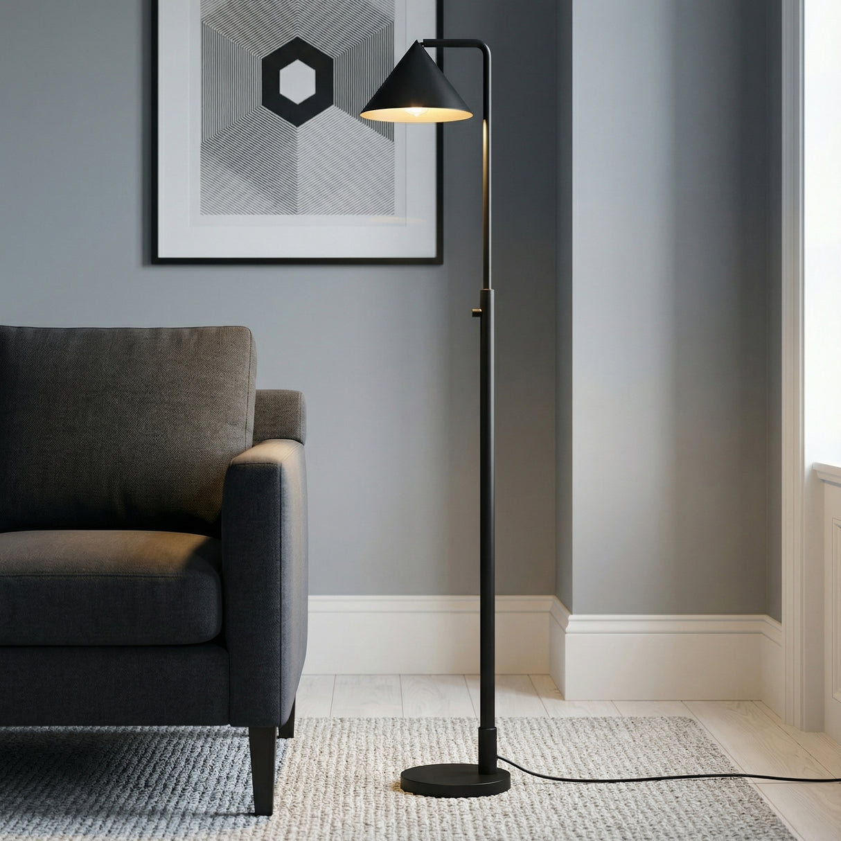 Juno Floor Lamp, Matte Black geometric Floor Lamp in a Modern Living Room with a charcoal sofa and geometric art.