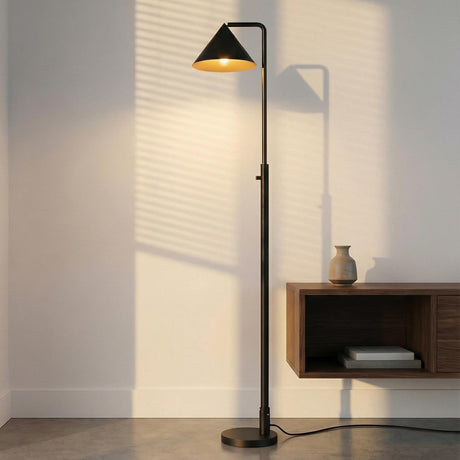 Juno Floor Lamp, Matte Black geometric Floor Lamp in a Modern Living Room with a floating wood console and ceramic vase.