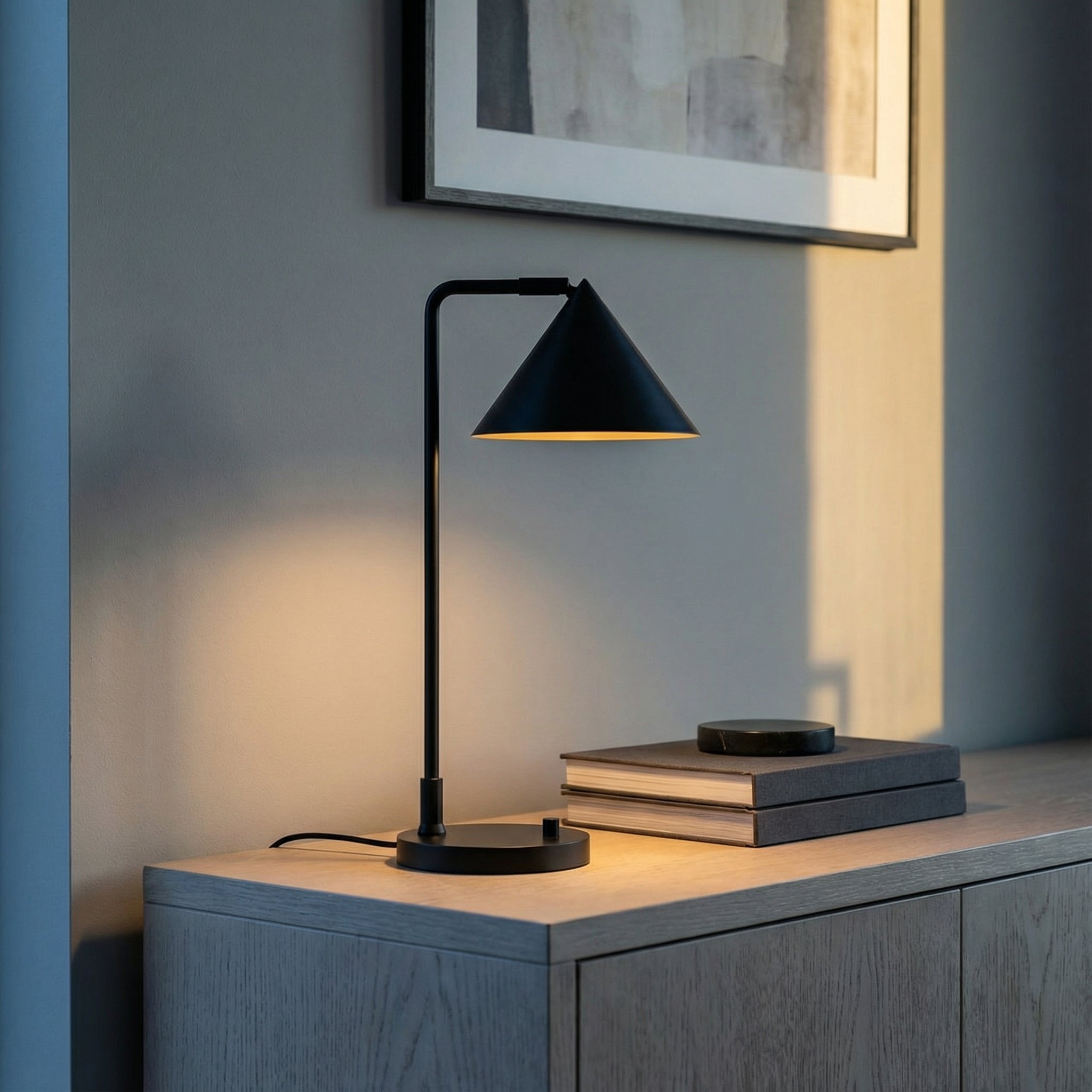 Juno Table Lamp, Matte Black styled in a Modern Living Room with a wooden sideboard.