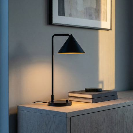 Juno Table Lamp, Matte Black styled in a Modern Living Room with a wooden sideboard.
