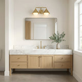 Brushed Brass and Opal Glass geometric vanity in a Modern Bathroom with a natural wood vanity and marble countertop.