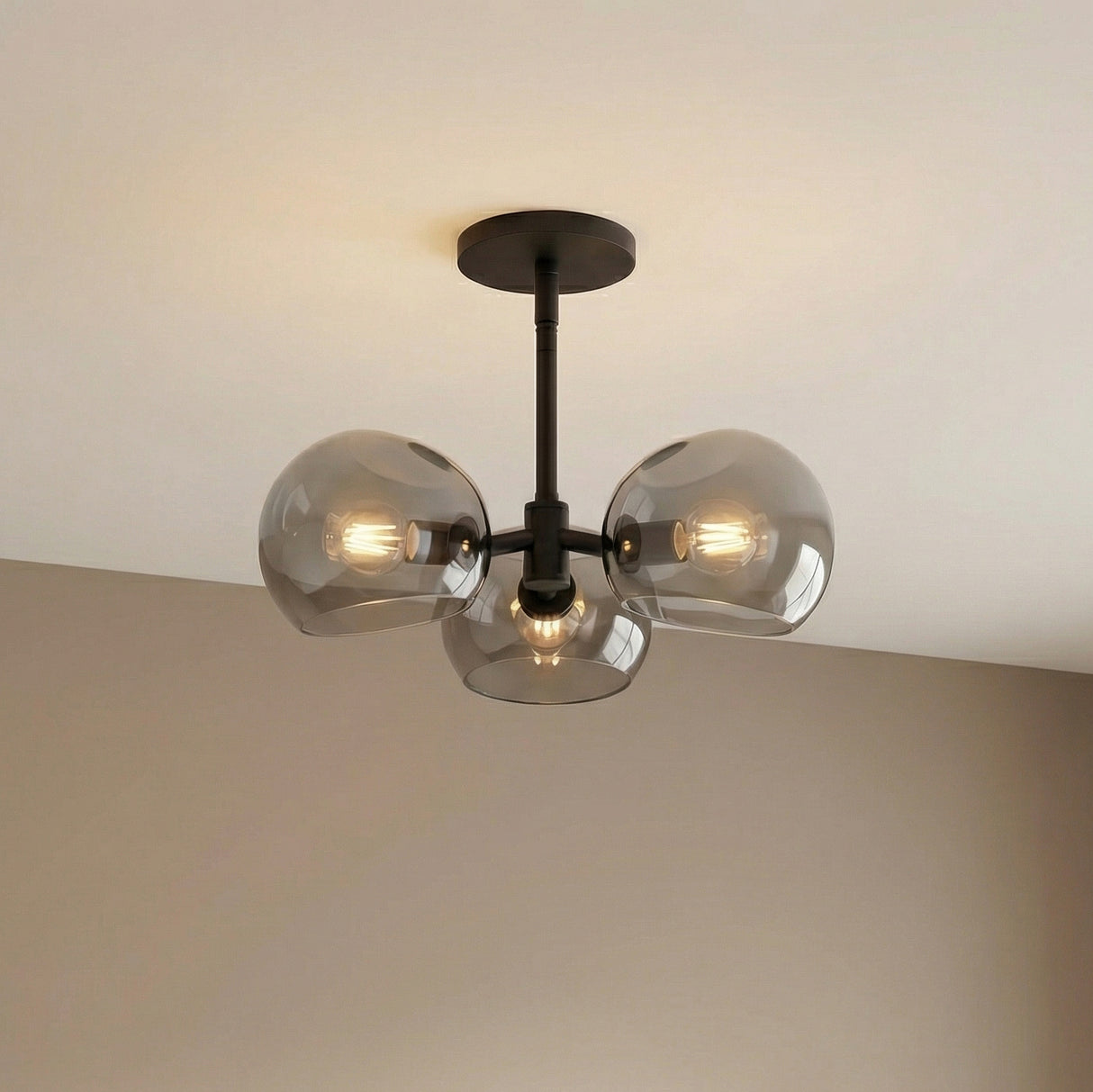 Flynn 3 Light Pendant 16" in a Modern Living Room with matte black accents and smoke glass.