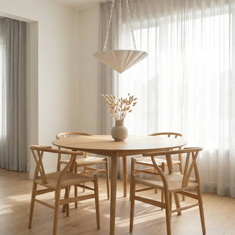 Cora Pendant 23", Textured White geometric pendant in a Modern Dining Room with a natural wood dining table.