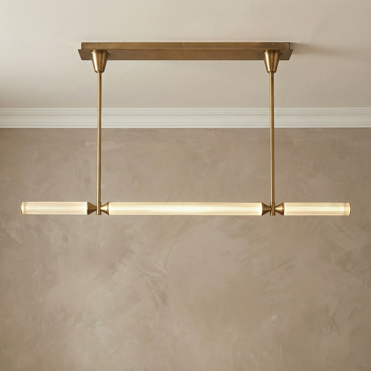Blain LED Linear Pendant 48", Vintage Brass linear Pendant in a Transitional Dining Room with a walnut dining table.